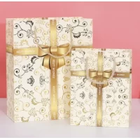 Пакет большой вертикальный "Золотой бант на белом" 26х32 см  