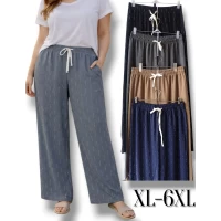 Брючки жіночі літні, вільного крою. AKFU. Тканина легенька жатка , гарно тягнуться, прикрашені сріблястими стразами. Йдуть в єдиному розмірі XL-6XL